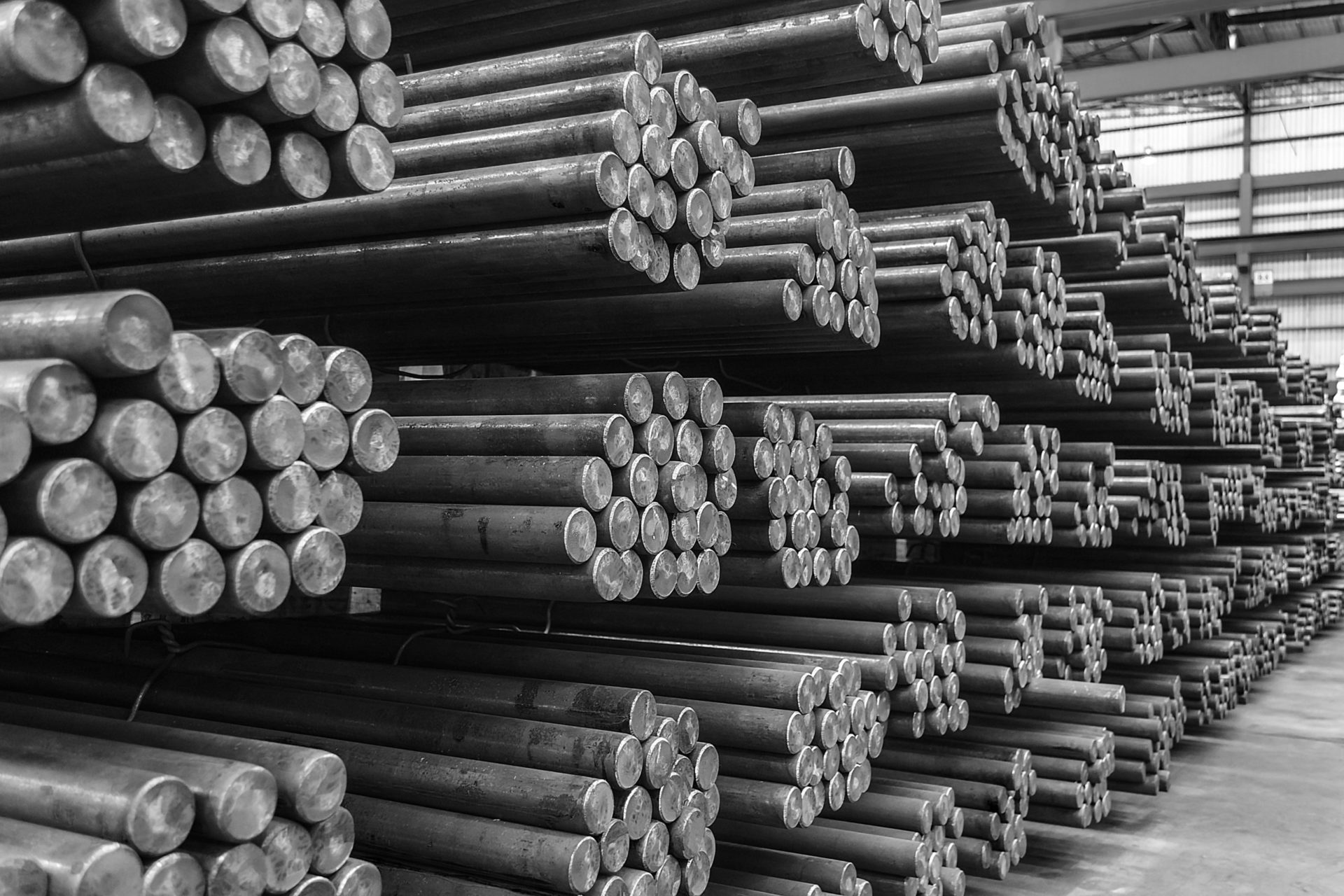 Steel round bar storage and stacking in warehouse.